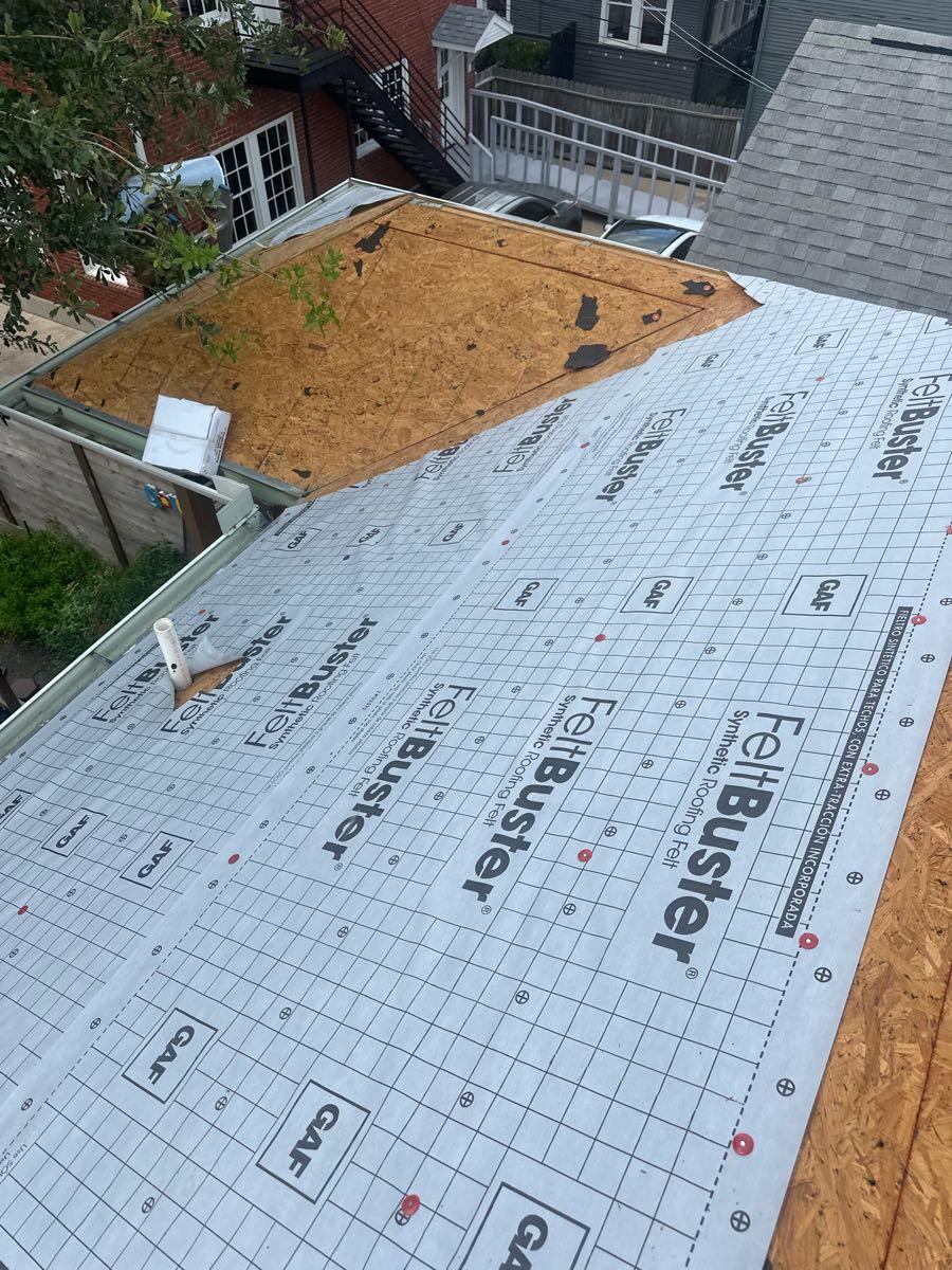 Synthetic roofing underlayment installed across exposed roof decking